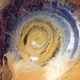 Illustration for article titled This Massive Spiral Structure in the Sahara Is Visible from Space